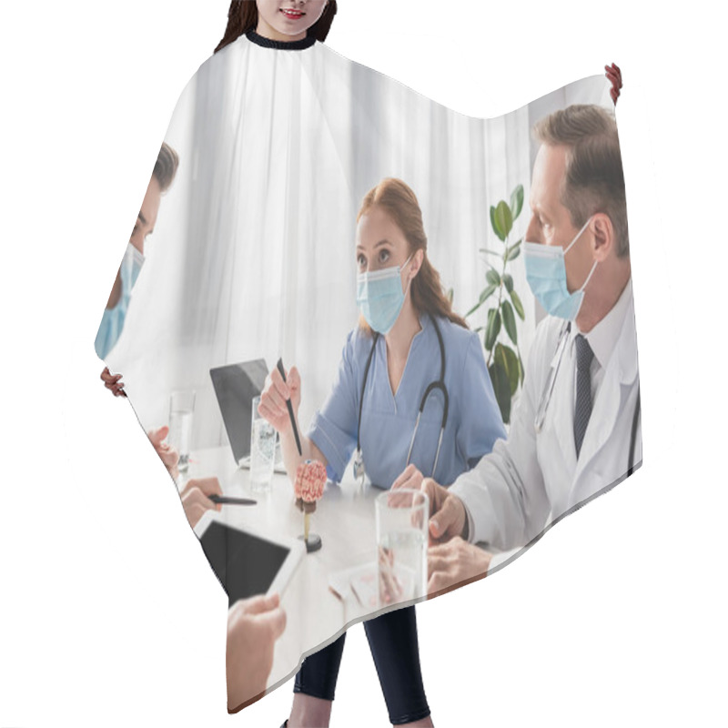 Personality  Multicultural Nurses And Doctors Working While Sitting At Workplace With Devices, Papers And Glasses Of Water On Blurred Foreground Hair Cutting Cape