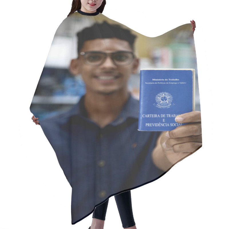 Personality  Mata De Sao Joao, Bahia, Brazil - October 1, 2020: Young Man Of Black Ethnicity Displays A Work And Social Security Card, A Necessary Document For Formalizing The Registration Of Work In Brazil. *** Local Caption *** Hair Cutting Cape