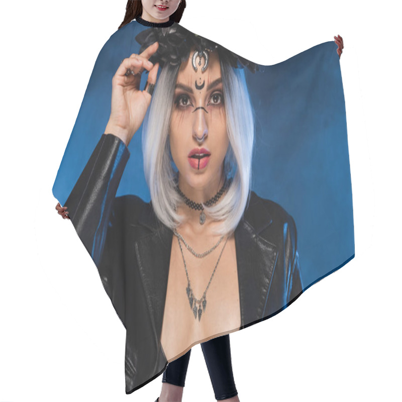 Personality  Sexy Woman In Witch Halloween Costume With Decollete Looking At Camera On Blue Foggy Background Hair Cutting Cape