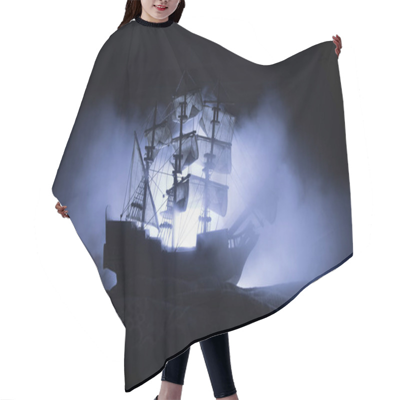 Personality  Black Silhouette Of The Pirate Ship In Night. Night Scene Of Ghost Pirate Ship In The Sea With Mysterious Light. Selective Focus Hair Cutting Cape