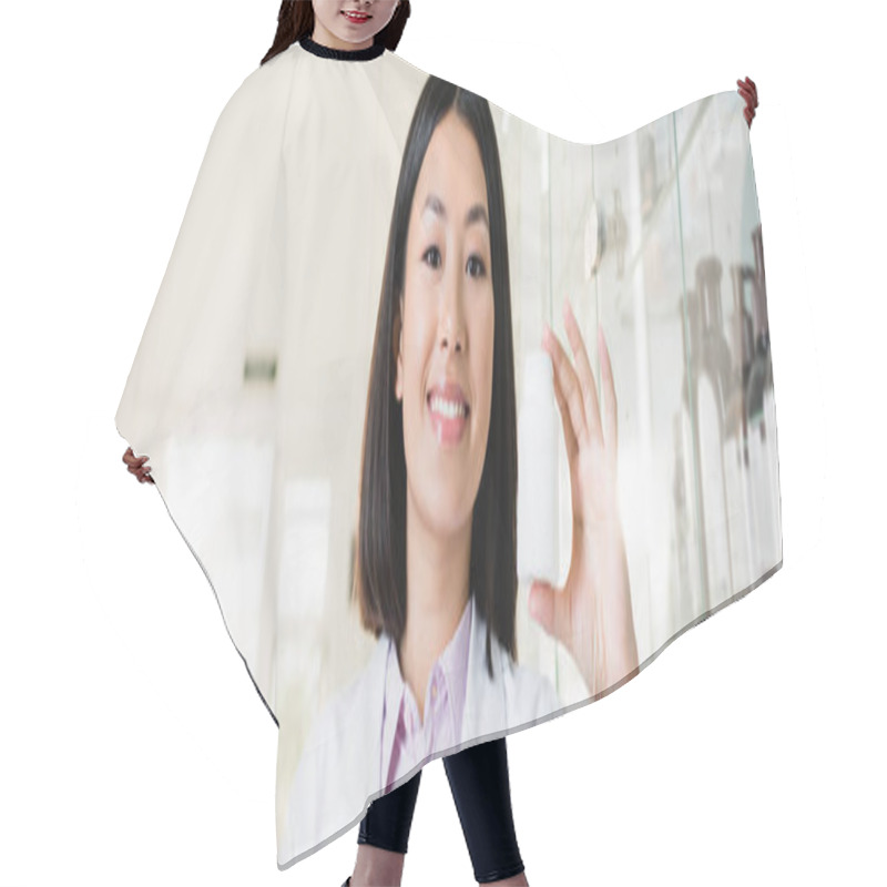 Personality  Cheerful Asian Pharmacist In White Coat Holding Bottle In Drugstore, Banner Hair Cutting Cape