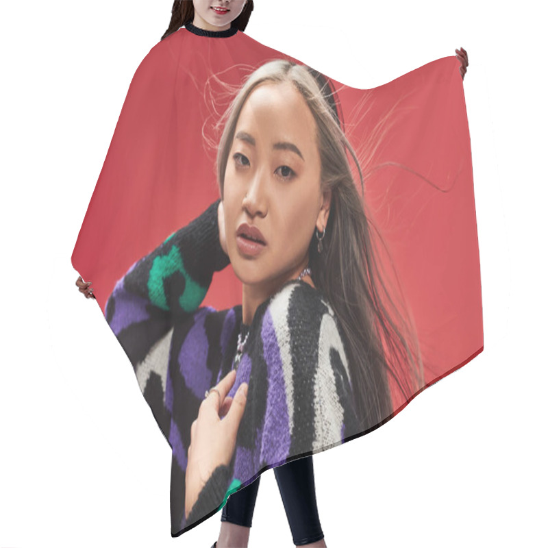 Personality  Wind Blowing At Face Of Alluring Young Asian Woman With Dyed Hair In Sweater With Animal Print Hair Cutting Cape