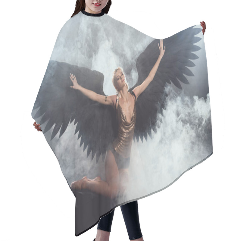 Personality  Beautiful Sexy Woman With Black Angel Wings And Outstretched Hands Sitting And Posing On Dark Smoky Background Hair Cutting Cape