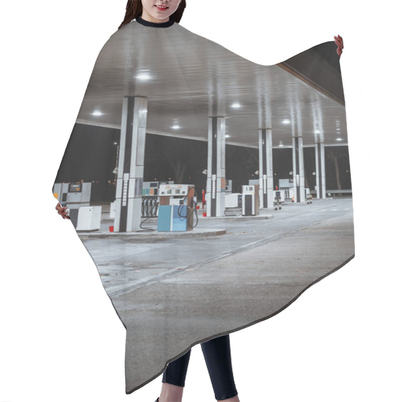 Personality  Illuminated Gas Station At Night With Clean Modern Design, Multiple Fuel Pumps, Reflective Canopy Roof, And Empty Lanes Under Bright Artificial Lighting; Long Exposure Vertical Shot, Portugal Hair Cutting Cape