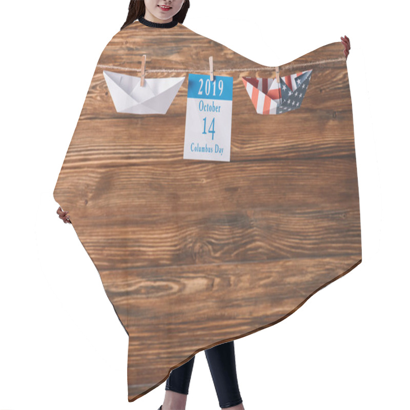 Personality  Calendar  With 14 October Date Between Paper Craft Boats On Wooden Surface Hair Cutting Cape