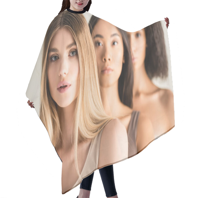 Personality  Blonde Woman Looking At Camera Near African American And Asian Models On Blurred Background Isolated On White Hair Cutting Cape