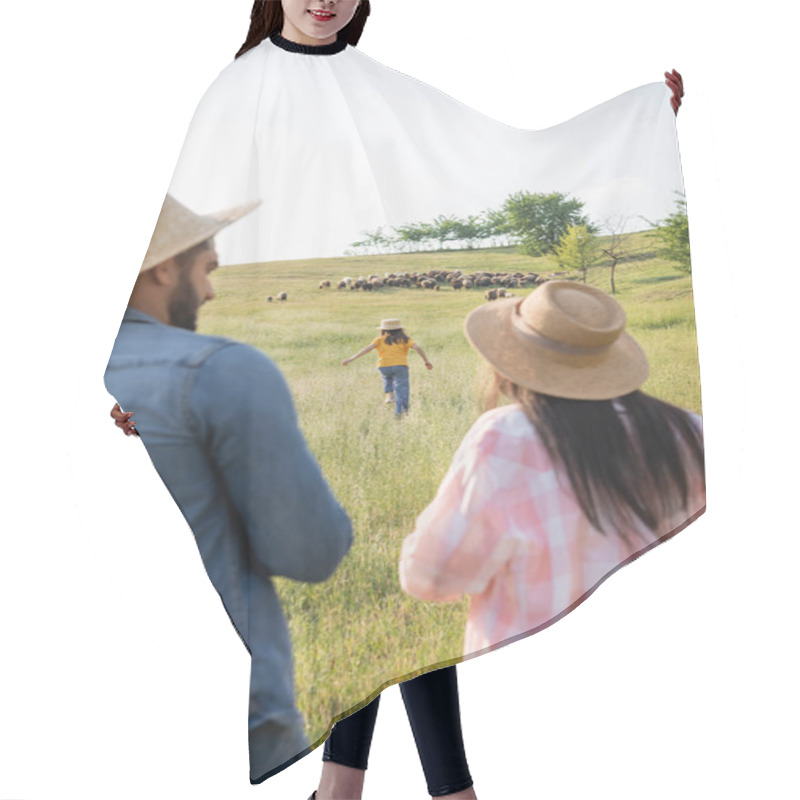 Personality  Back View Of Blurred Farmers In Straw Hats Looking At Daughter Running Towards Grazing Herd Hair Cutting Cape