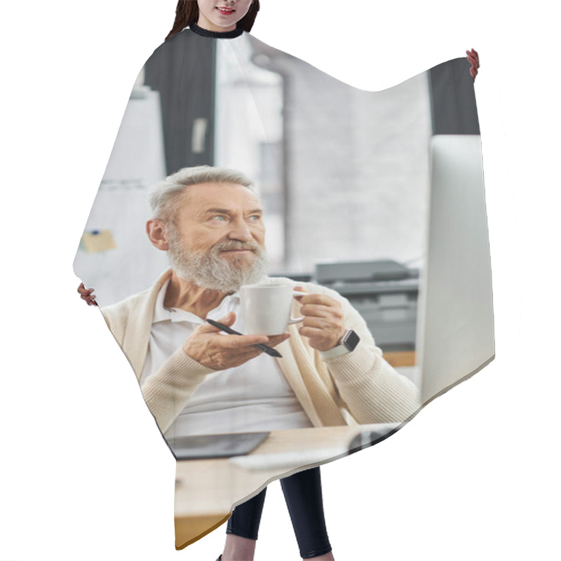 Personality  A Mature Handsome Man Thoughtfully Holds A Cup Of Coffee While Sitting At His Workspace. Hair Cutting Cape