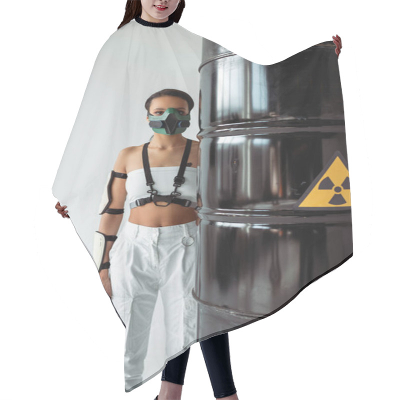 Personality  Futuristic African American Woman In Safety Mask Near Radioactive Waste Barrels Isolated On White Hair Cutting Cape