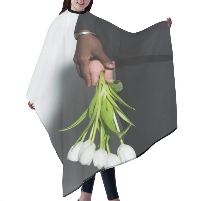 Personality  Cropped View Of African Ameican Man Touching Hand Of Woman Holding White Tulips On Grey With Shadow Hair Cutting Cape