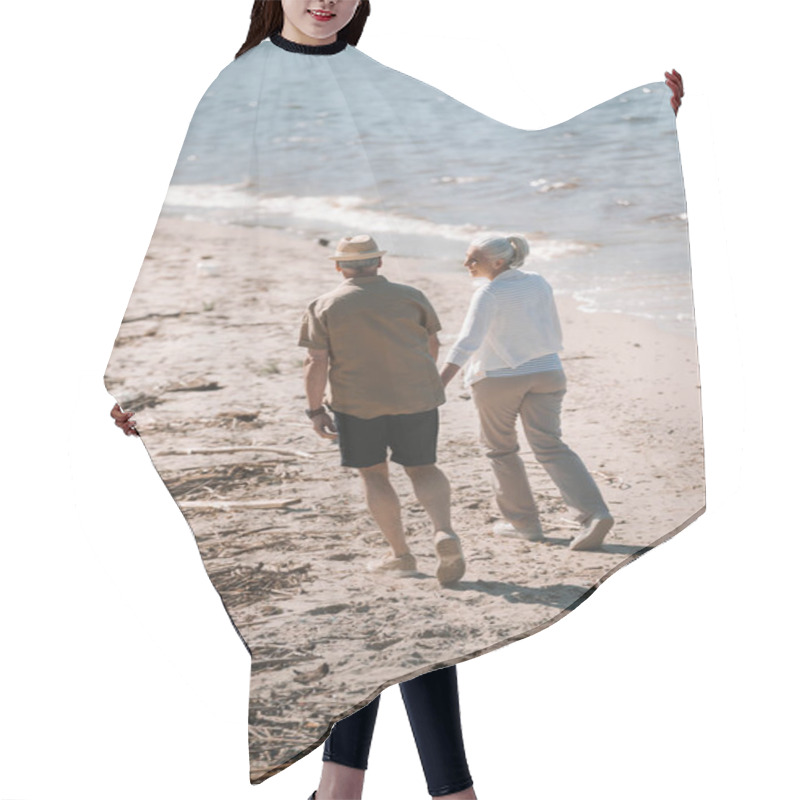 Personality  Senior Couple Walking On Beach  Hair Cutting Cape