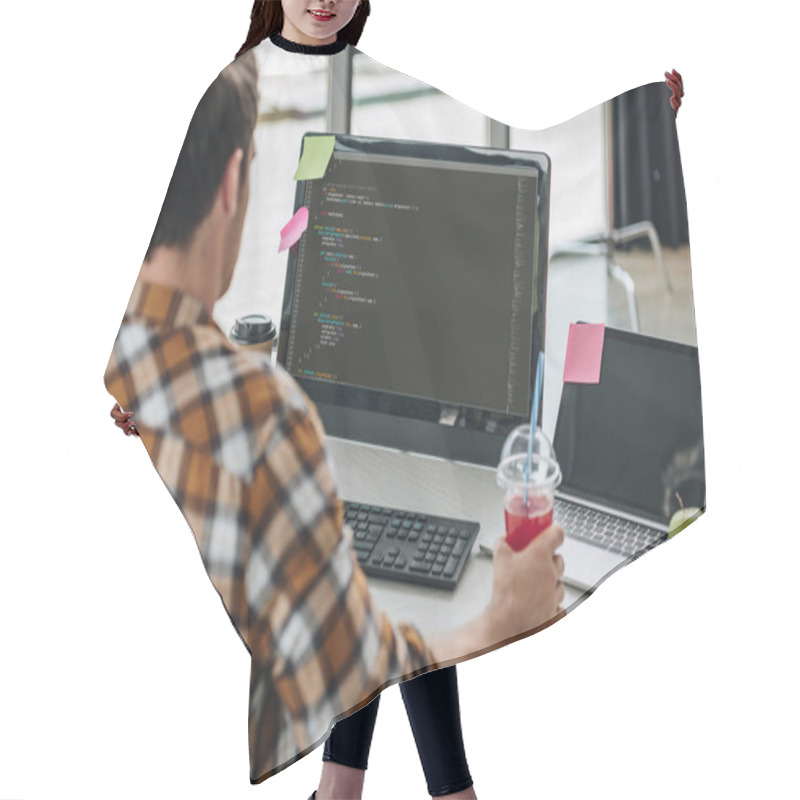 Personality  Back View Of Young Programmer Holding Glass Of Juice While Working On Computer In Office Hair Cutting Cape