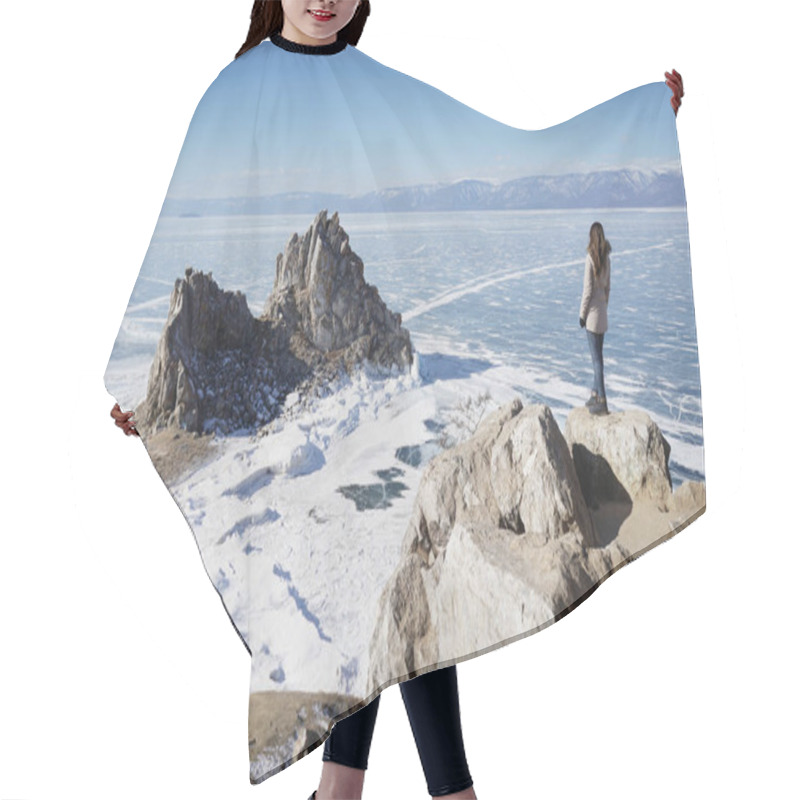 Personality  Lake Baikal In Winter. Woman Standing On A Cliff And Looking At Burkhan Cape And Shaman Rock. Hair Cutting Cape