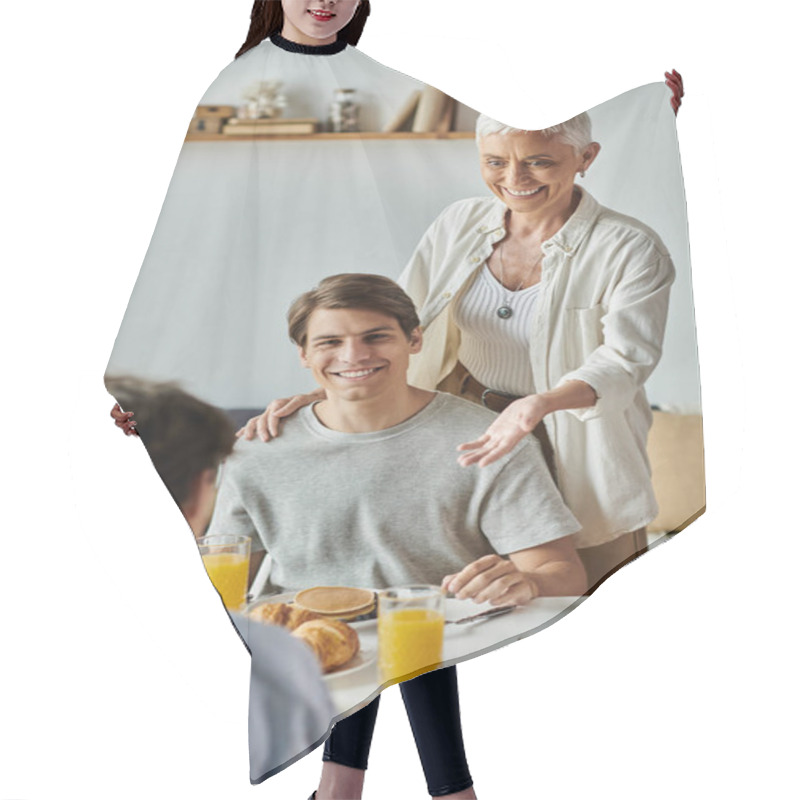 Personality  Lesbian Parents And Their Adult Son Share Laughter And Love Over Breakfast In A Sunny Kitchen. Hair Cutting Cape