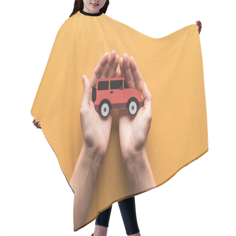 Personality  Partial View Of Woman Holding Paper Cut Car On Orange Background Hair Cutting Cape