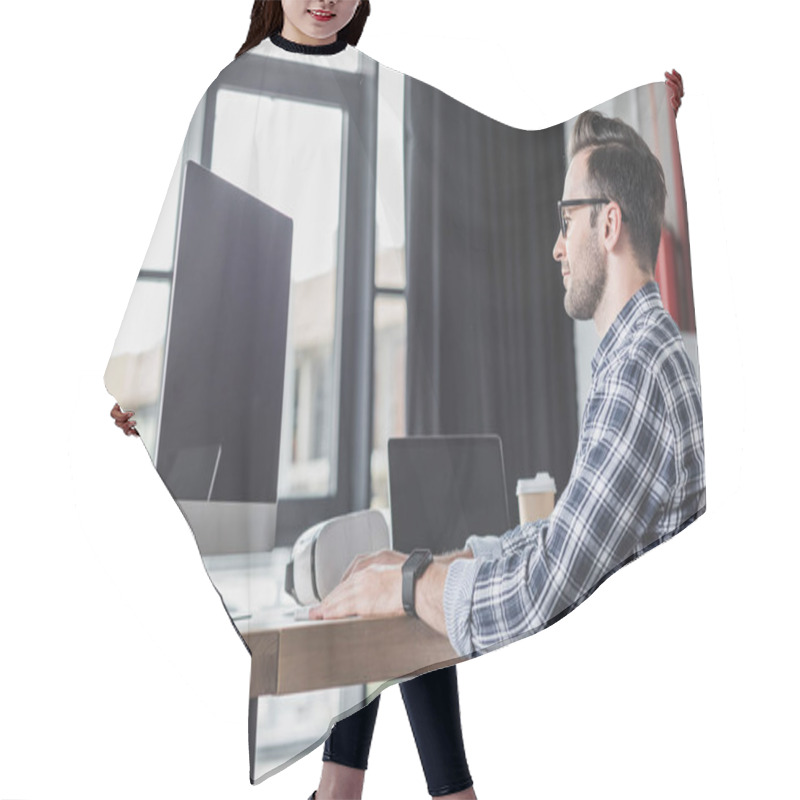 Personality  Handsome Smiling Young Programmer In Eyeglasses Working With Desktop Computer And Laptop Hair Cutting Cape