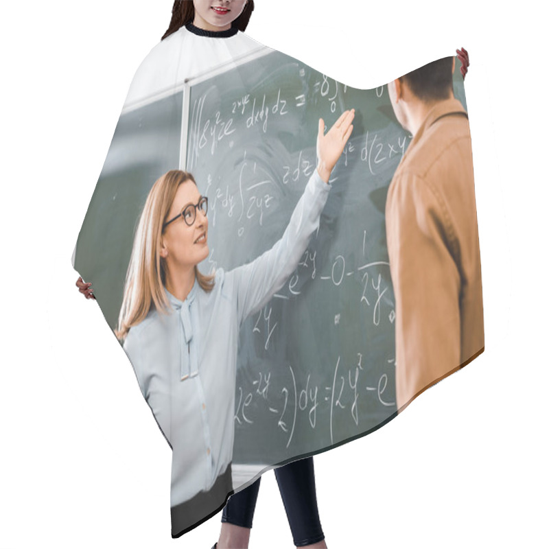 Personality  Female Professor Showing Equations In Classroom  Hair Cutting Cape