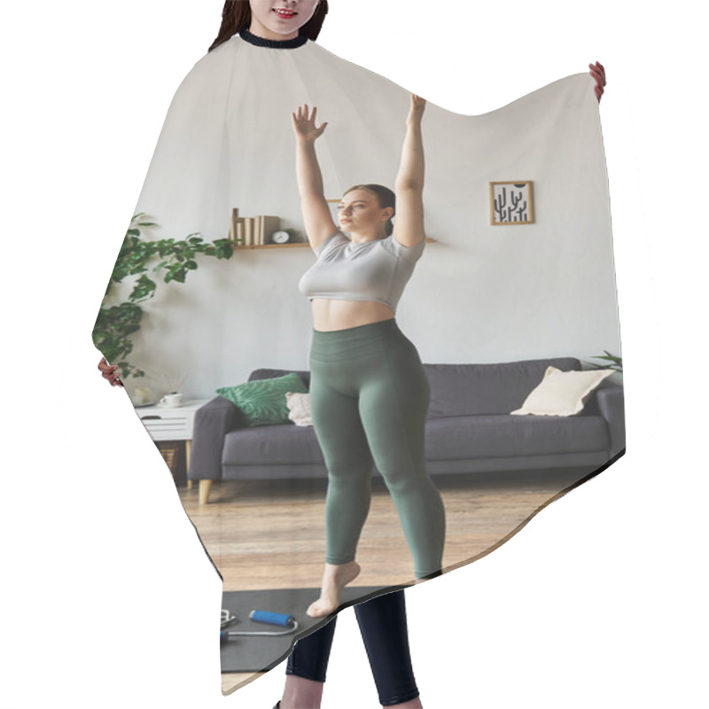 Personality  A Sportive Young Woman Performs A Stretching Exercise At Home, Enjoying Her Workout Routine. Hair Cutting Cape