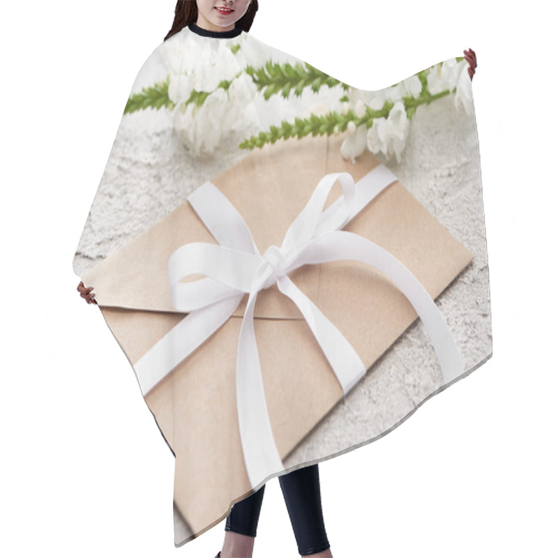 Personality  Beige Envelope With White Ribbon Near Flowers On Grey Textured Surface   Hair Cutting Cape