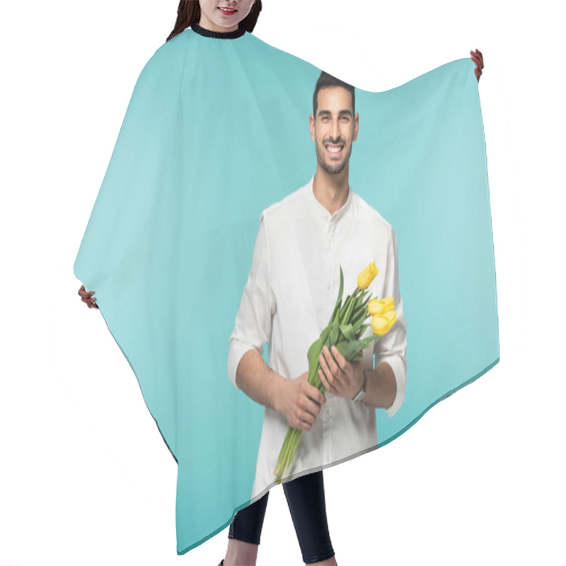 Personality  Positive Arabian Man Holding Tulip Flowers Isolated On Blue  Hair Cutting Cape