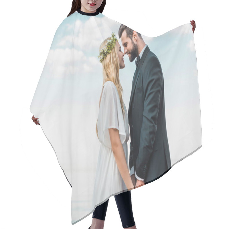 Personality  Wedding Couple In Suit And White Dress Holding Hands And Touching With Noses On Beach Hair Cutting Cape