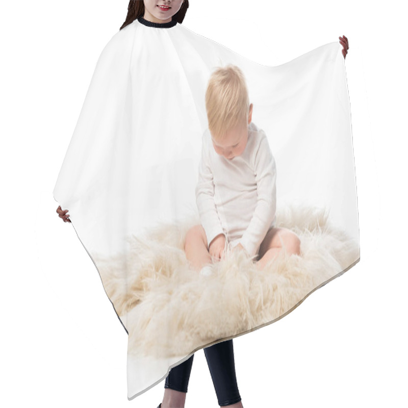 Personality  Cute Child With Lowered Head Sitting On Fur On White Background Hair Cutting Cape