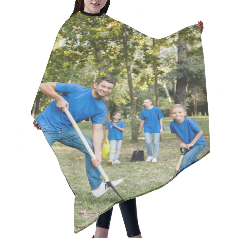 Personality  Father And Son Smiling At Camera While Digging Ground, And Mother With Daughter Holding Young Tree And Watering Can On Blurred Background, Ecology Concept Hair Cutting Cape