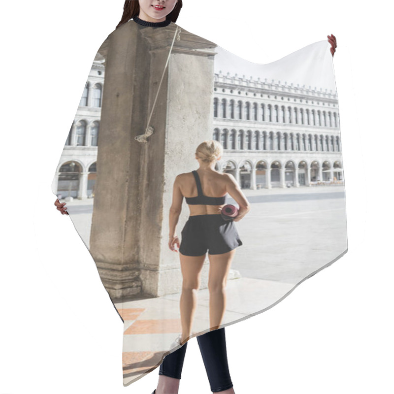 Personality  Back View Of Fit Sportswoman In Black Crop Top, Shorts And White Sneakers Holding Fitness Mat On Urban Street In Venice  Hair Cutting Cape