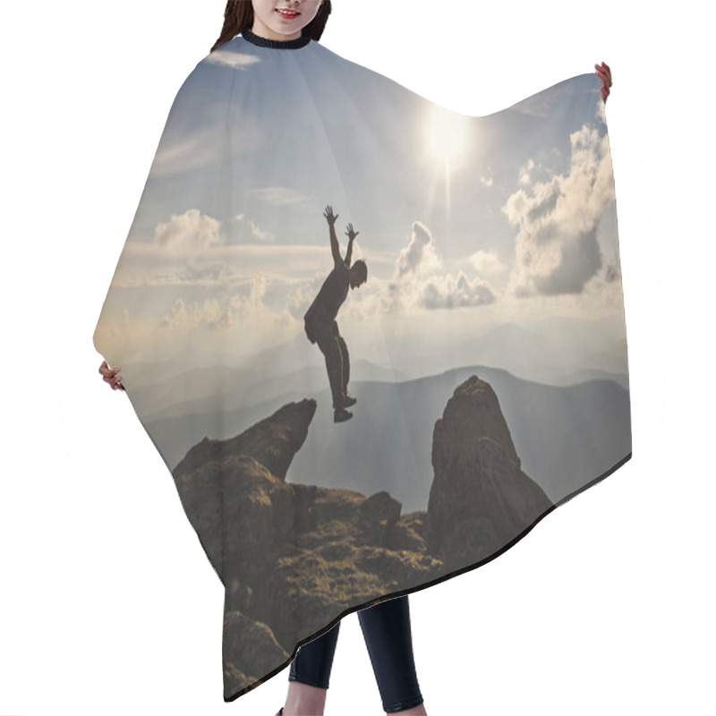 Personality  Hiker With Backpack Jumping Over Rocks  Sunset Sky On The Background Hair Cutting Cape