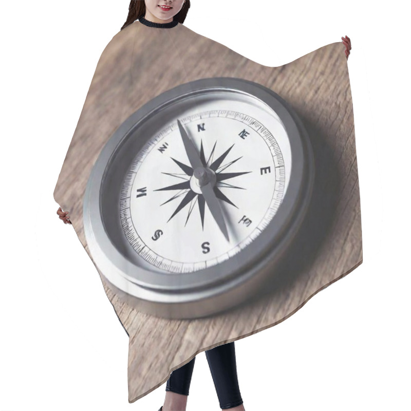 Personality  A High-resolution Digital Artwork Of A Close-up Compass. The Detailed Compass Features A Sleek, Modern Design With A Metallic Silver Pointer And Intricate Blue Directional Markers. The Compass Rests Against A Textured, Light-wood Surface, Adding A Hair Cutting Cape