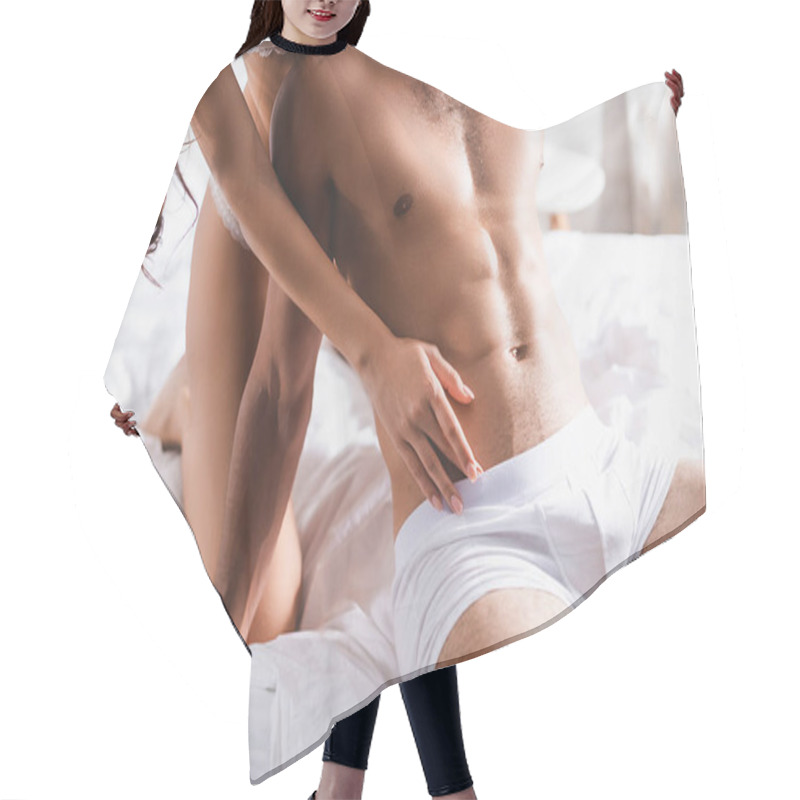 Personality  Cropped View Of Sexy Woman Touching Torso Of Muscular Man In White Underpants On Bed  Hair Cutting Cape