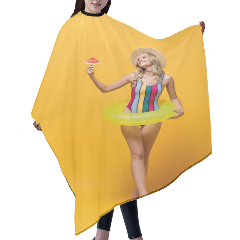 Personality  Full Length Of Smiling Woman Standing With Inflatable Ring And Holding Popsicle Stick With Watermelon On Yellow Hair Cutting Cape