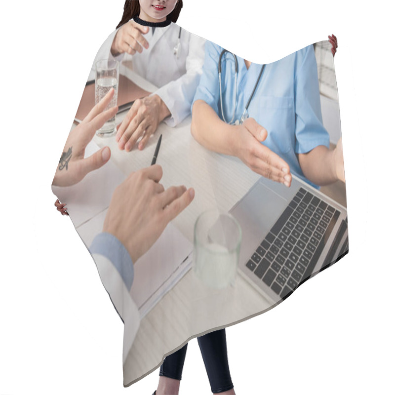 Personality  Cropped View Of African American Nurse Pointing With Hand At Laptop Near Colleagues At Workplace With Papers In Hospital Hair Cutting Cape