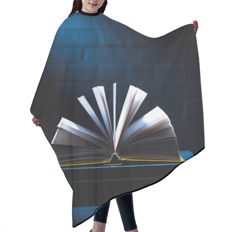 Personality  Open Book With Empty Pages On Dark Tabletop Hair Cutting Cape