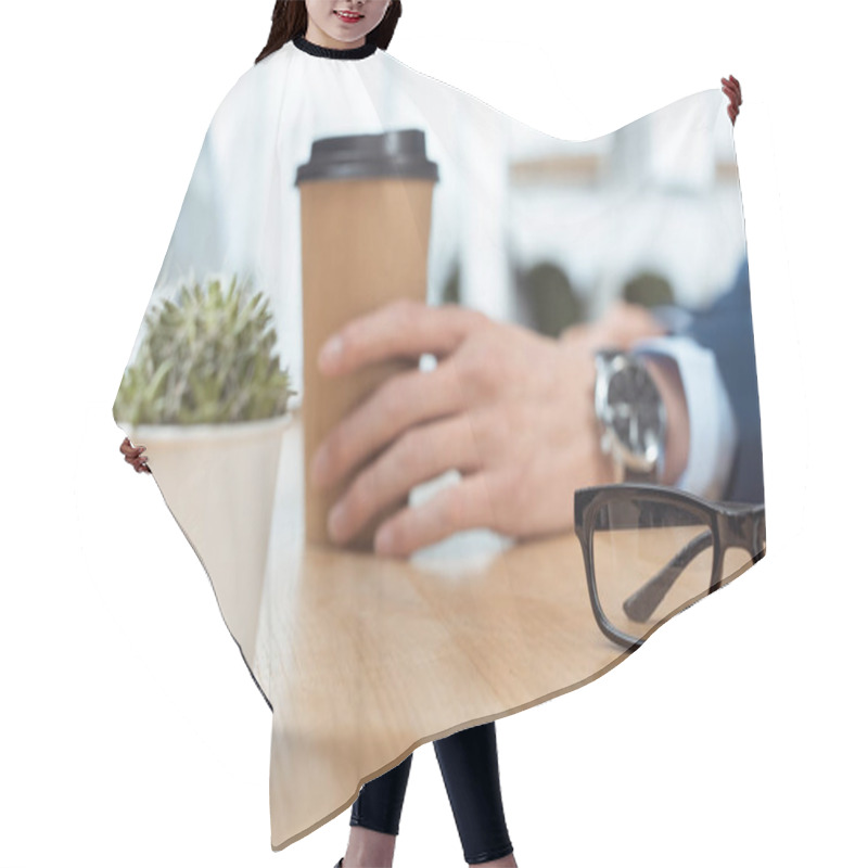 Personality  Cropped Image Of Businessman Sitting With Disposable Coffee Cup At Table With Potted Plant And Eyeglasses In Modern Office  Hair Cutting Cape