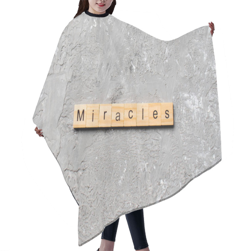 Personality  The Miracles Word Written On Wood Block. Miracles Text On Cement Table For Your Desing, Concept. Hair Cutting Cape