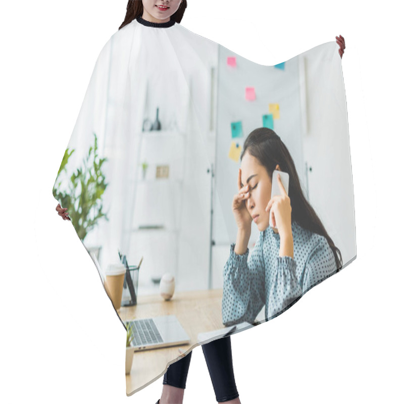 Personality  Stressed Asian Businesswoman Sitting At Computer Desk And Talking On Smartphone In Office Hair Cutting Cape