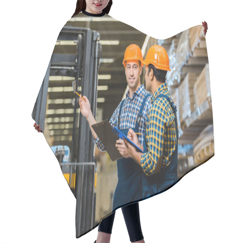 Personality  Smiling Warehouse Worker In Uniform And Helmet Talking To Indian Colleague Hair Cutting Cape