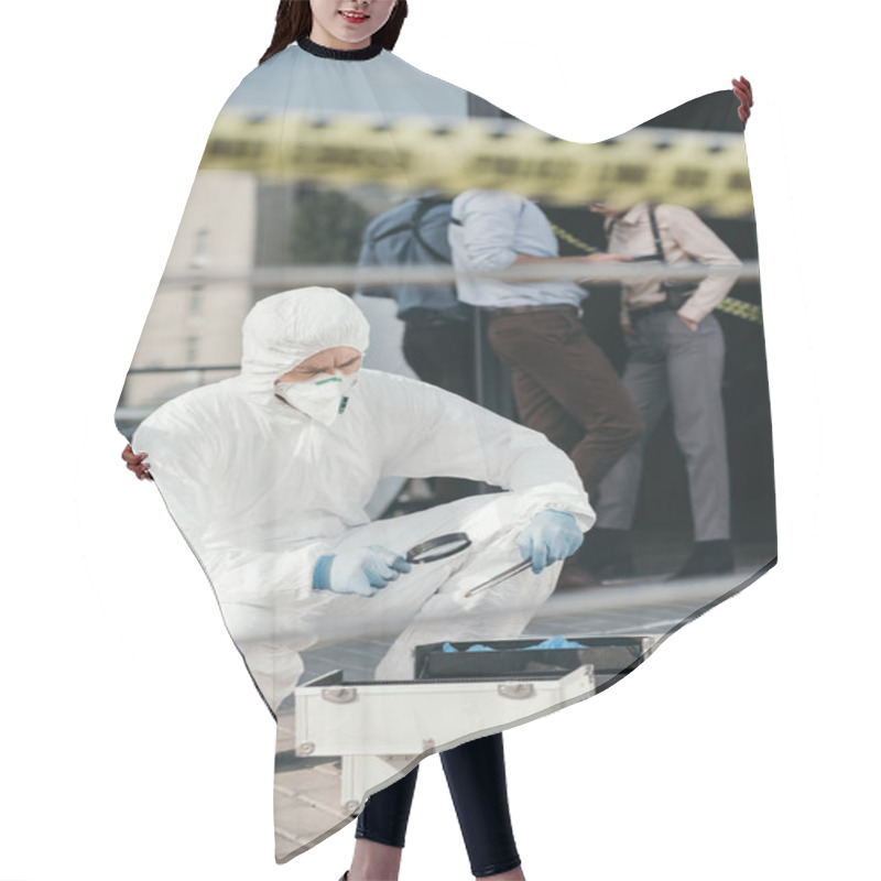 Personality  Male Criminologist In Protective Suit And Latex Gloves Looking Through A Magnifier At Important Evidence Hair Cutting Cape