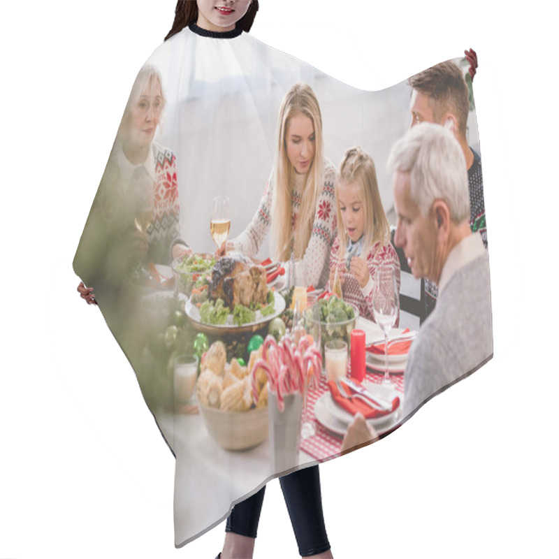 Personality  Selective Focus Of Family Members Sitting At Table And Celebrating Christmas  Hair Cutting Cape