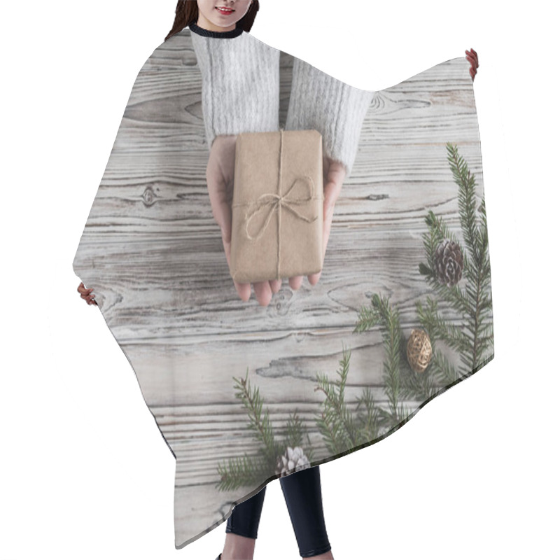 Personality  Female Packing Gifts. Cardboard Box In Craft Paper, Christmas Rope And Tree On The Rustic Wood Planks Background. DIY. Hair Cutting Cape