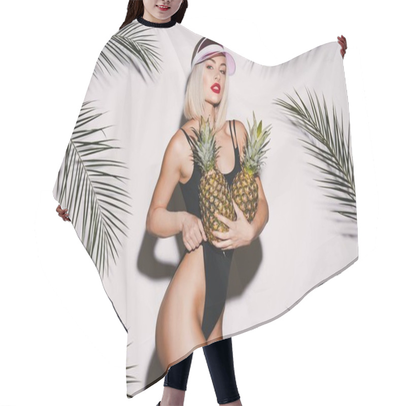 Personality  Lovely Girl With Blonde Hair Wearing Black Swimming Suit And Pink Cap Standing With Pineapples At White Studio Background With Palms, Sexy Model Hair Cutting Cape