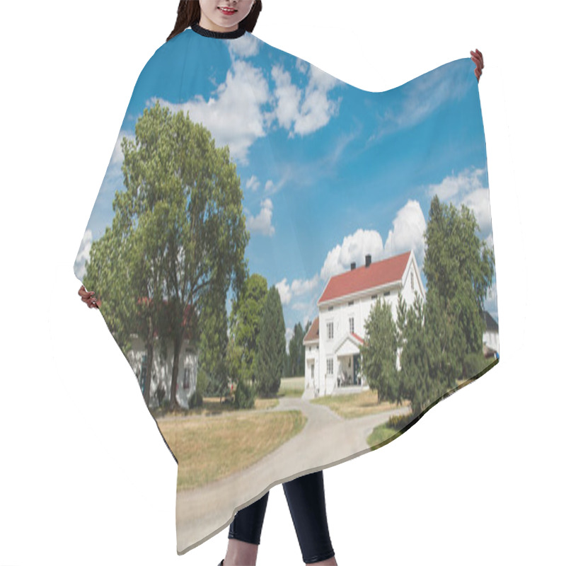 Personality  HAMAR, HEDMARK, NORWAY - 26 JULY 2018: Living Houses And Trees Under Cloudy Blue Sky Hair Cutting Cape