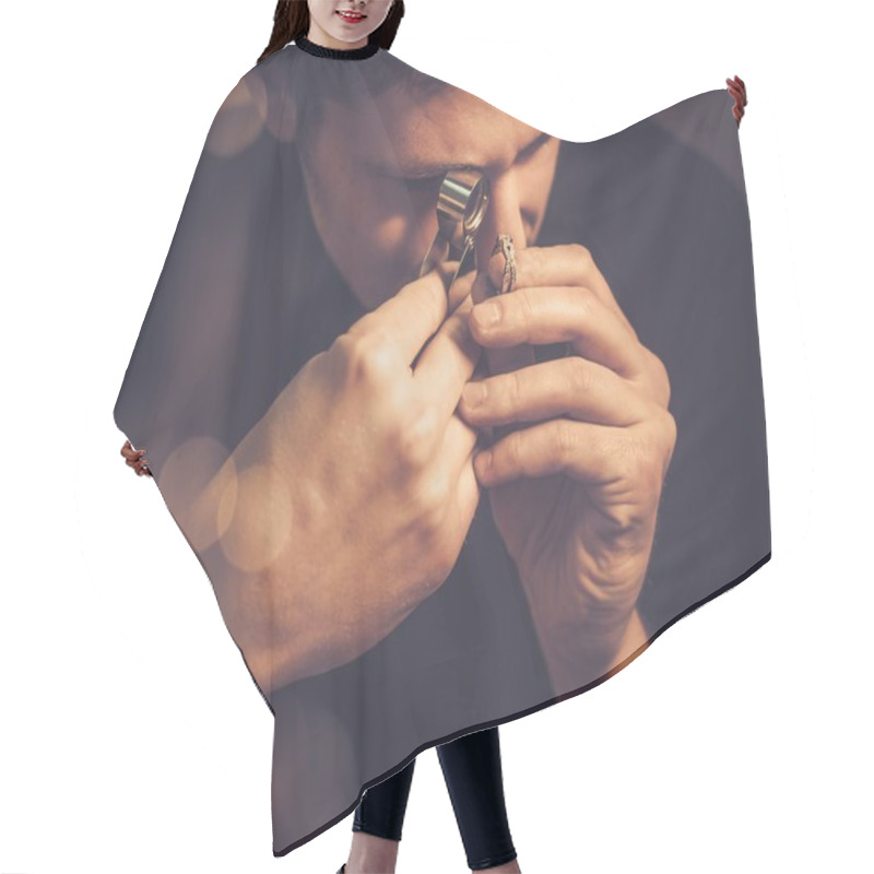 Personality  Portrait Of A Jeweler During The Evaluation Of Jewels.  Hair Cutting Cape