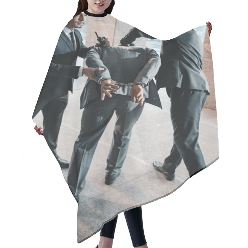 Personality  Cropped Image Of Security Guards Arresting Offender Hair Cutting Cape