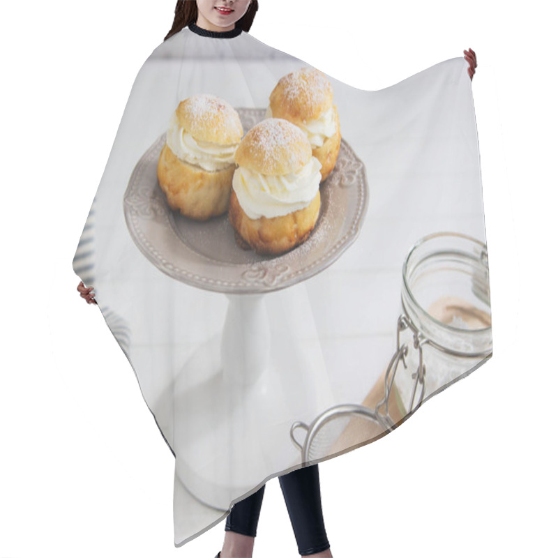 Personality  Fastelavn buns sweet powder traditional nordic food. hair cutting cape