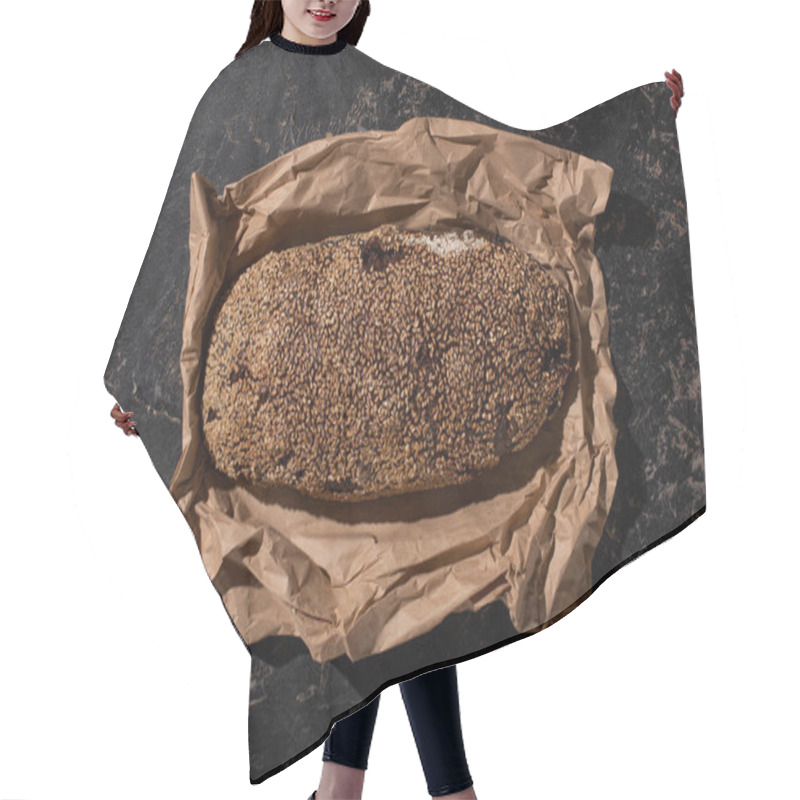 Personality  Top View Of Fresh Baked Loaf Of Whole Grain Bread With Sesame In Paper On Stone Black Surface Hair Cutting Cape