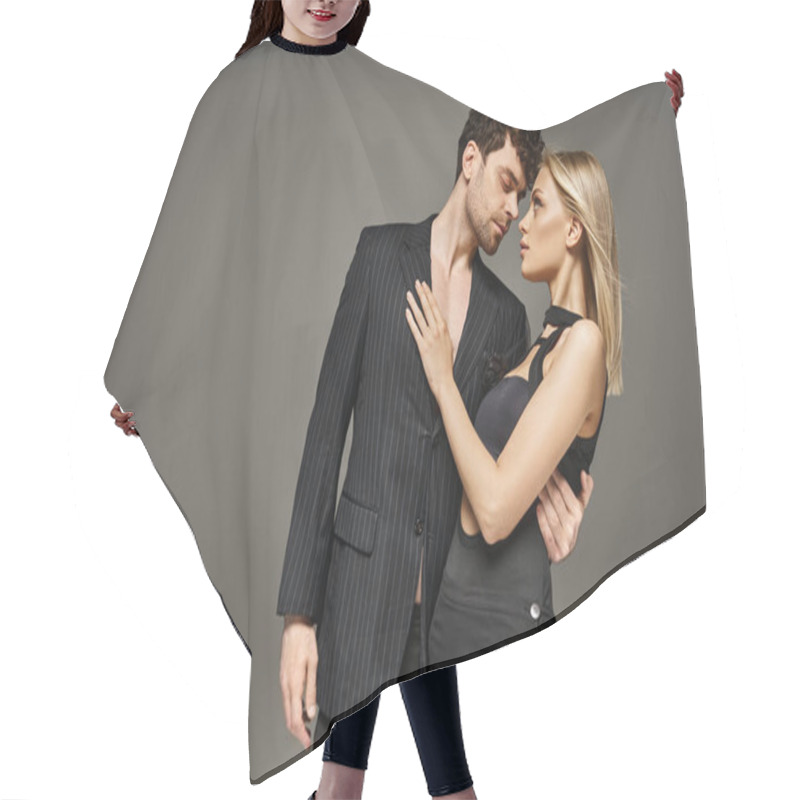 Personality  Attractive Woman And Man In Elegant Evening Attire Posing On Grey Background, Stylish Couple Hair Cutting Cape