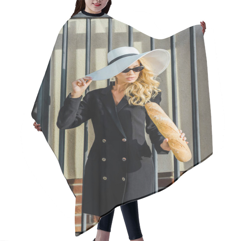 Personality  Attractive Young Woman In Stylish Jacket And Hat Standing In Front Of Fence With Fresh Baguette Hair Cutting Cape