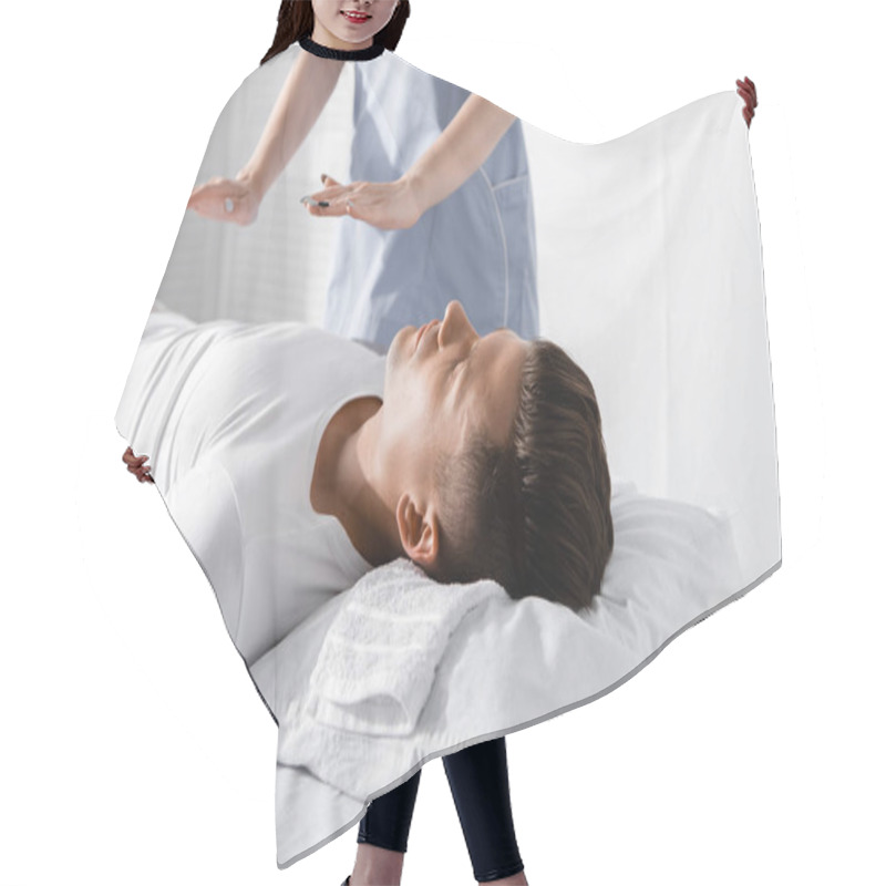 Personality  Partial View Of Healer Standing Near Man On Massage Table And Holding Hands Above His Body Hair Cutting Cape